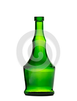 An empty bottle of an unusual shape made of dark green glass for cognac, whiskey on a white background