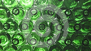 Empty bottles. Slider shot of empty glass bottles. Top view in production line. Empty green beer bottles, the top view