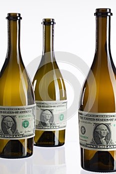 Empty bottles of wine from the label of dollar bill