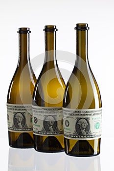 Empty bottles of wine from the label of dollar bill