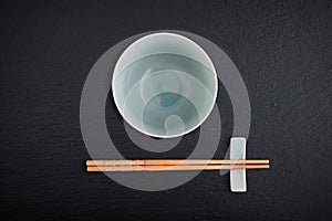 Empty bowl and bamboo chopsticks