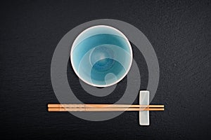 Empty bowl and bamboo chopsticks