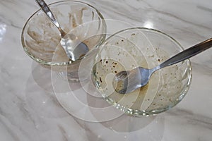 Empty bowl of ice cream on marble table.