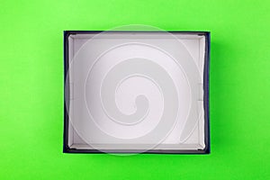 Empty box for product on green background. top view