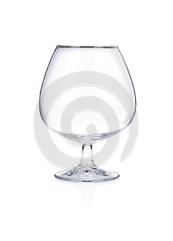 Empty brandy cognac glass isolated on white