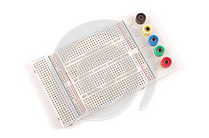 Empty breadboard for electronics prototyping isolated on the white background