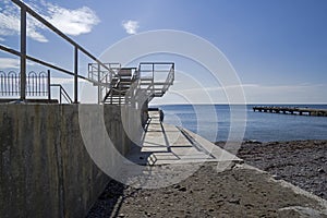 Empty breakwater on an empty beach. Off season