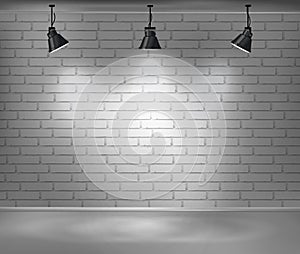 Empty brick wall. Blank room is illuminated by three lamps. Background for advertising indoors.
