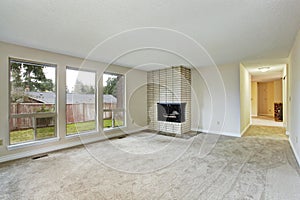 Empty bright living room with fireplace