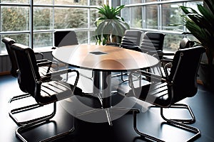 Empty and bright meeting room in a office, elegant workplace with a round table, chairs and plants