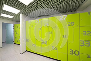 Empty bright modern cloakroom in gym with numerous