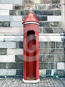 Empty bright red sentry box in the front of Christiansborg palace in Copenhagen
