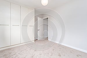 Empty bright room with a carpet flooring