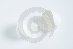 An empty broken egg shell on a white background