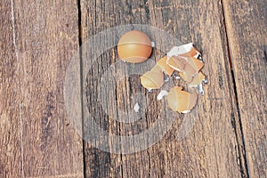 Empty broken egg shell on wooden table background