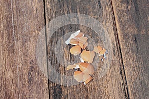 Empty broken egg shell on wooden table background