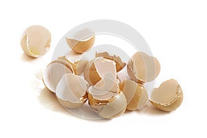 Empty broken eggshells on white