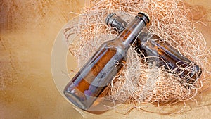 Empty brown glass beer bottles with shade and browned bottom