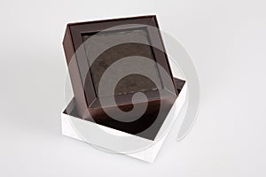 Empty brown open small Gift Box with White cower in grey background