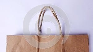 Empty brown shopping bag made of recycled paper.