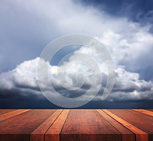 Empty brown wooden table surface and clou sky blurred background image, for product display montage,can be used for montage or dis