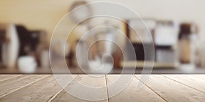 Empty brown wooden table top with out of focus lights bokeh rustic coffee shop background, product placement template