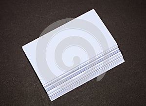 Empty business cards on dark background