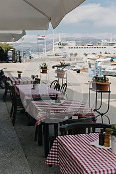 Empty cafe on the embankment in Supetar, Brac island, Croatia. Travel destination in Croatia