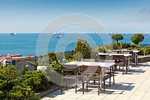 Empty cafe tables high over city and Marmara sea, Istanbul