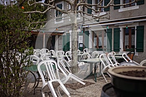 Empty cafe terrace in a tranquil European village during siesta