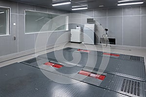 Empty can inspection room. Clean vehicle repair workshop interior. Automobile service space