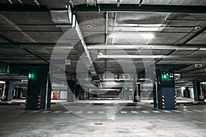 Empty car parking garage underground interior inside in apartment building or in mall or supermarket