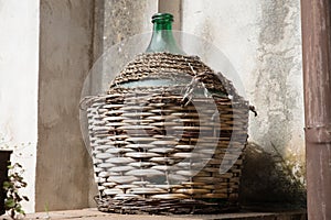 Empty carboy in rustic house