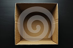 Empty cardboard box on a black background