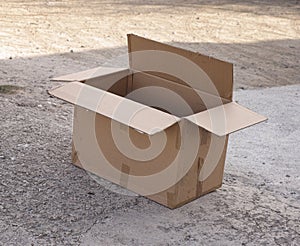 Empty cardboard box on the ground