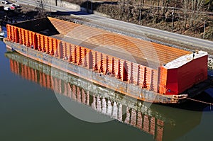 Empty cargo boat berthing at riverside