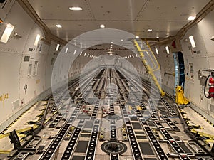 Empty cargo hold of a large airplane.