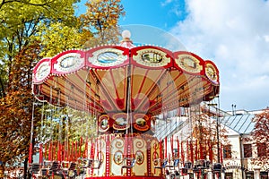 Empty Carousel Merry-Go-Round With Seats Suspended On Chains Wi