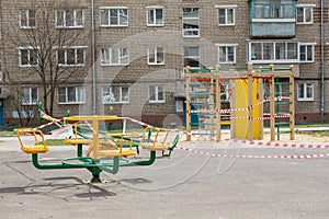 An empty carousel and a playground tied with prohibitive ribbons in Russia due to the global impact of COVID-19