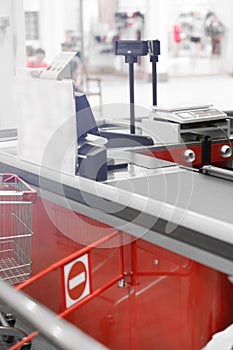 Empty cash desk with closed way border in supermarket