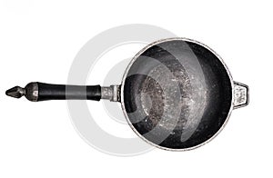 Empty cast iron frying pan on white background