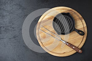 an empty cast iron pan and steak fork