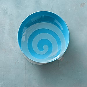 Empty ceramic blue round plate stone background top view flat lay