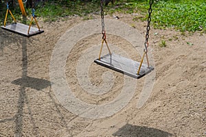 Empty chain old swing in playground
