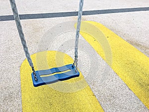 Empty chain swings in children playground