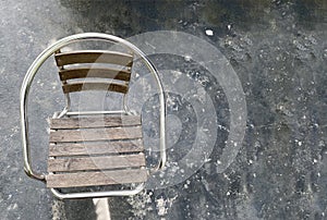 empty chair on dark cement floor background.