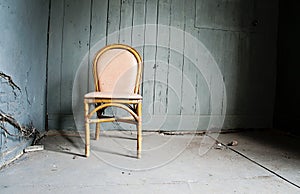 Empty chair and grungy wall