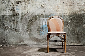 Empty chair and grungy wall