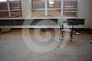 Empty Chair Sits in Classroom