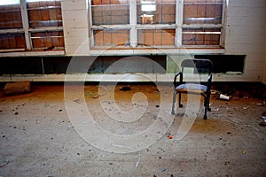 Empty Chair Sits in Classroom